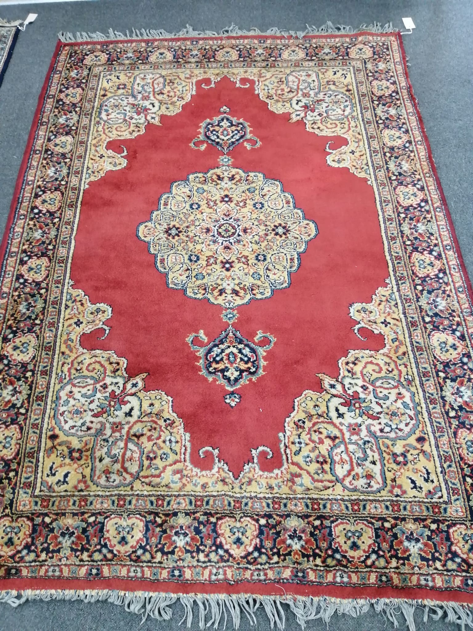 A Belgian machined red ground rug, in Kerman style, 190 x 131cm